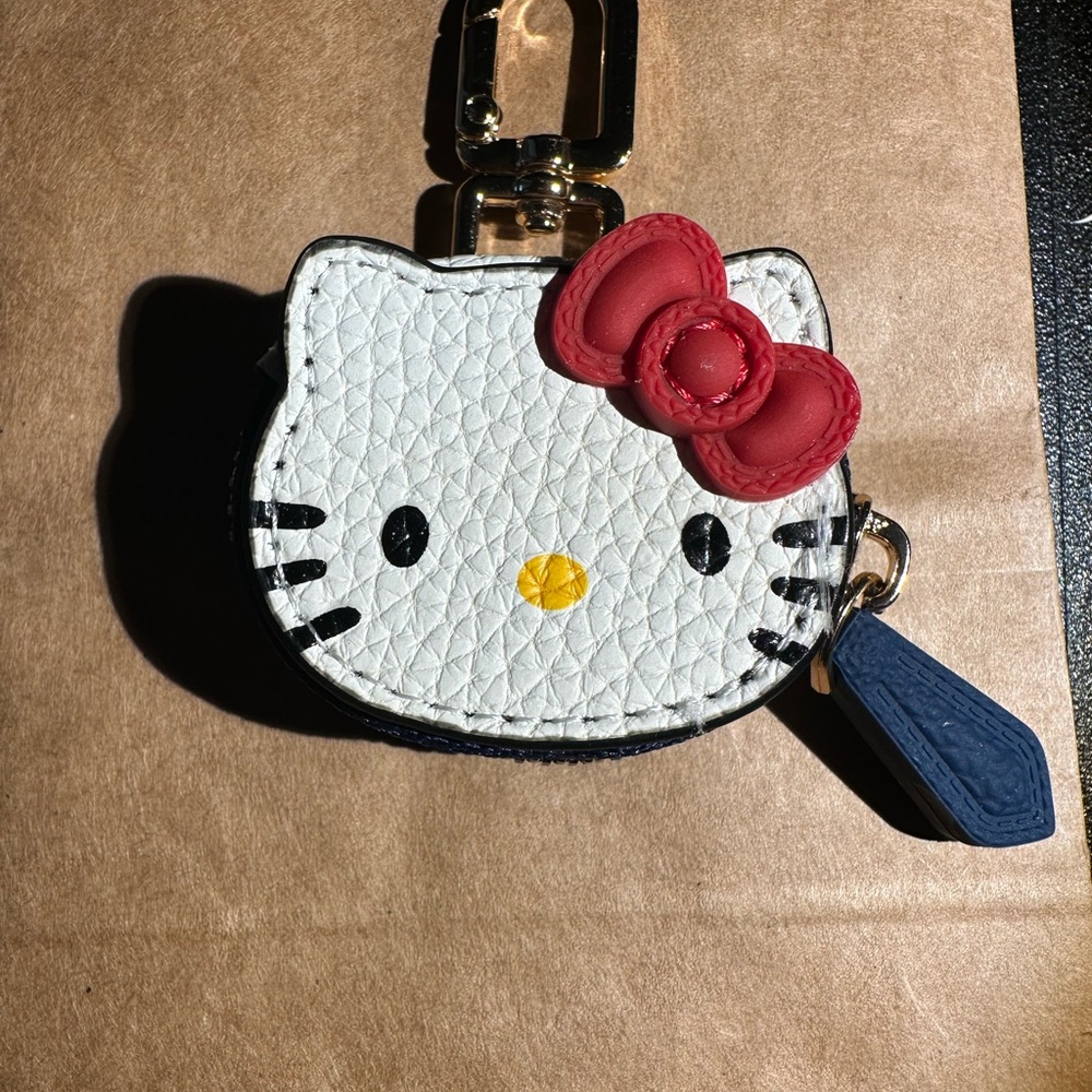 Sanrio Hello Kitty Coin Pouch/Apple tag. Compare to Madison de Sabre brand